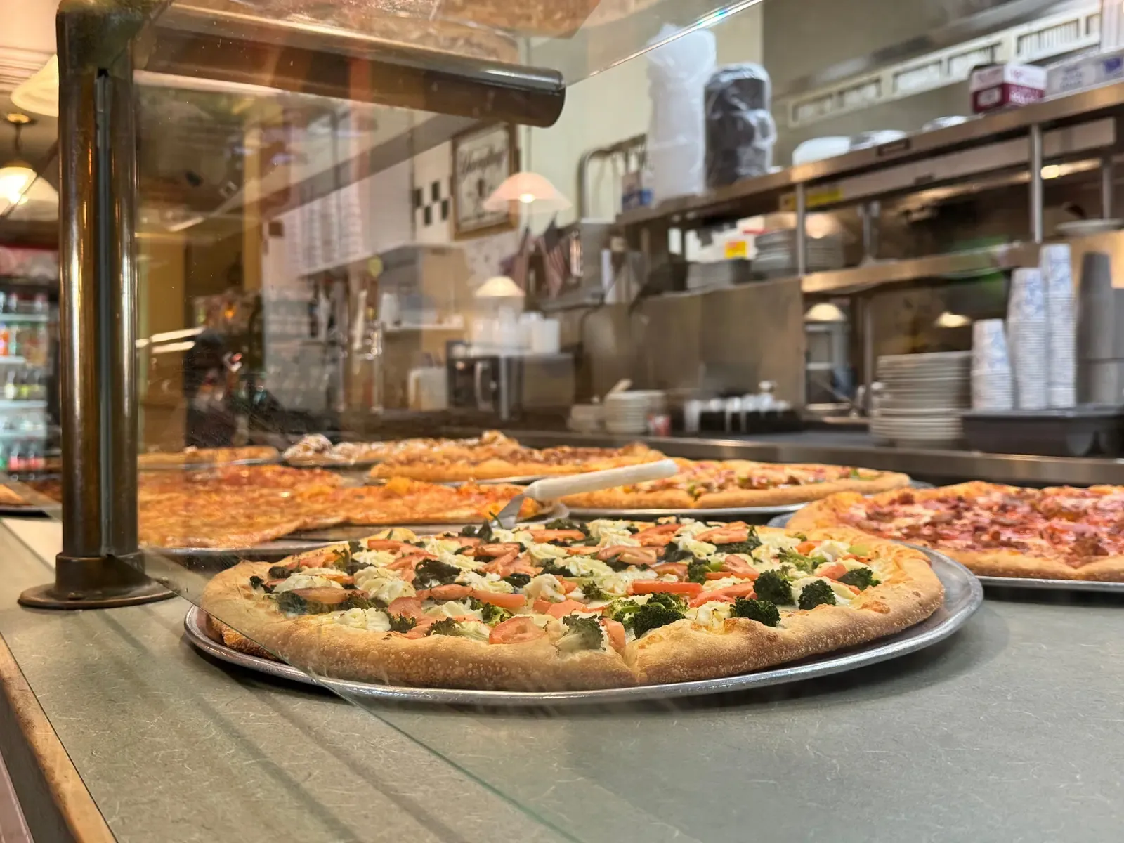 Dough stretched by hand in Rudy's kitchen