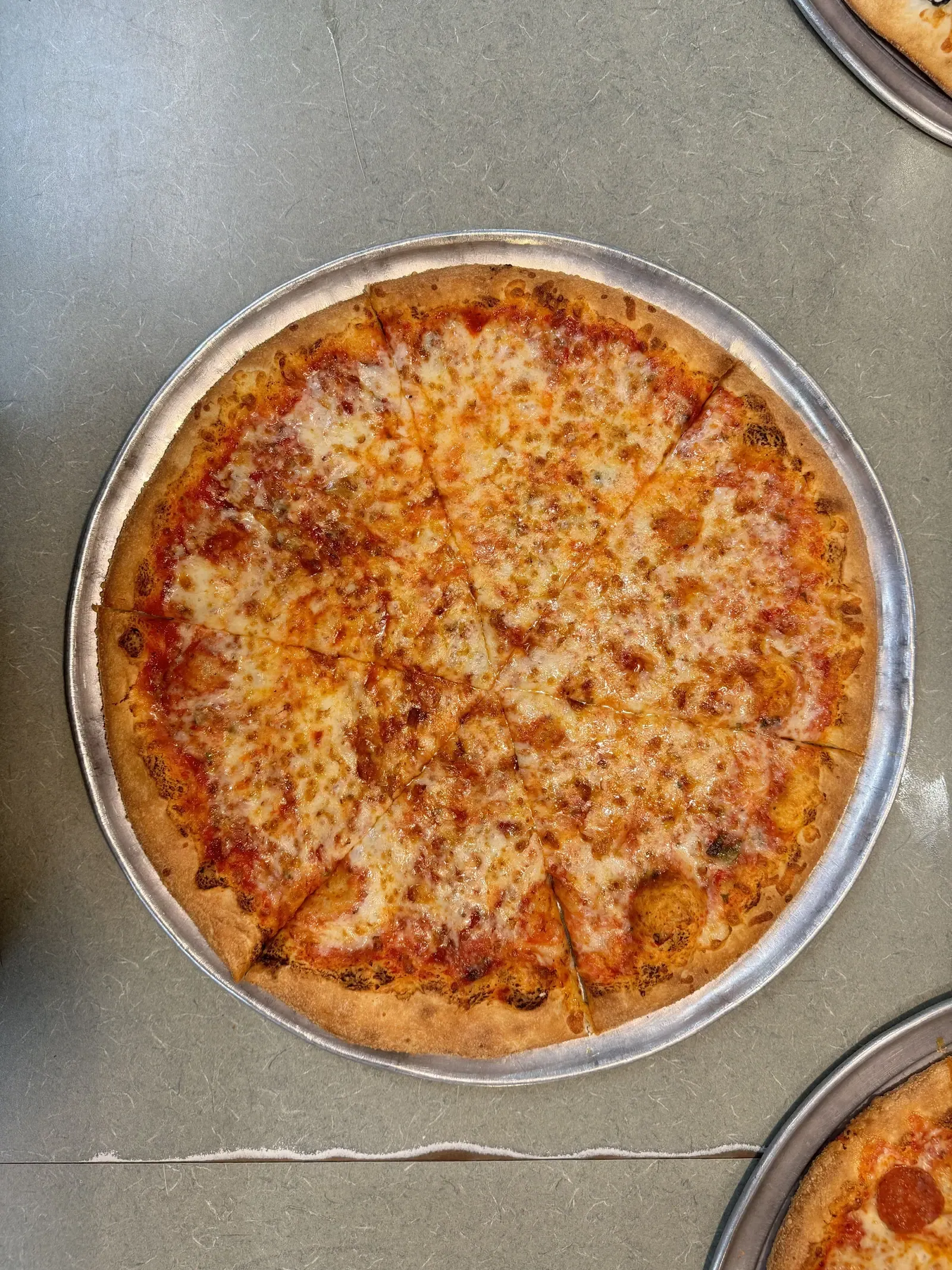 Sicilian cheese pizza cut into thick square slices at Rudy's in Newark, DE