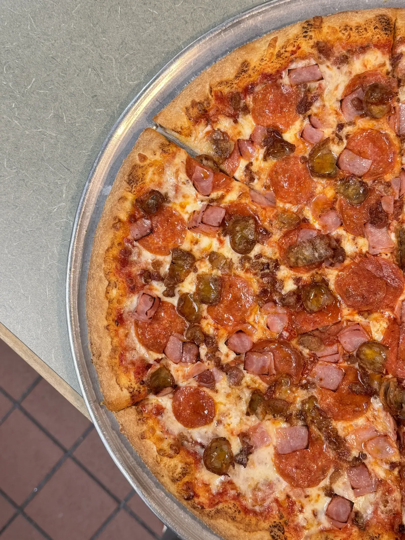 Stuffed meat lover's pizza, a double-crust pie cut to show the filling