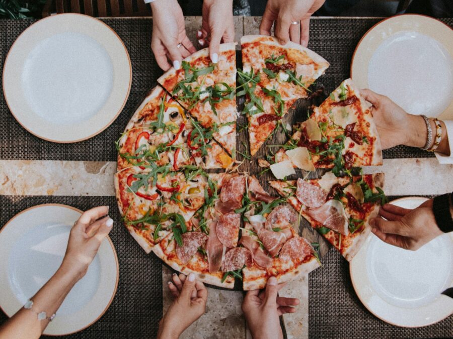 Fusion pizza topped and ready to slice