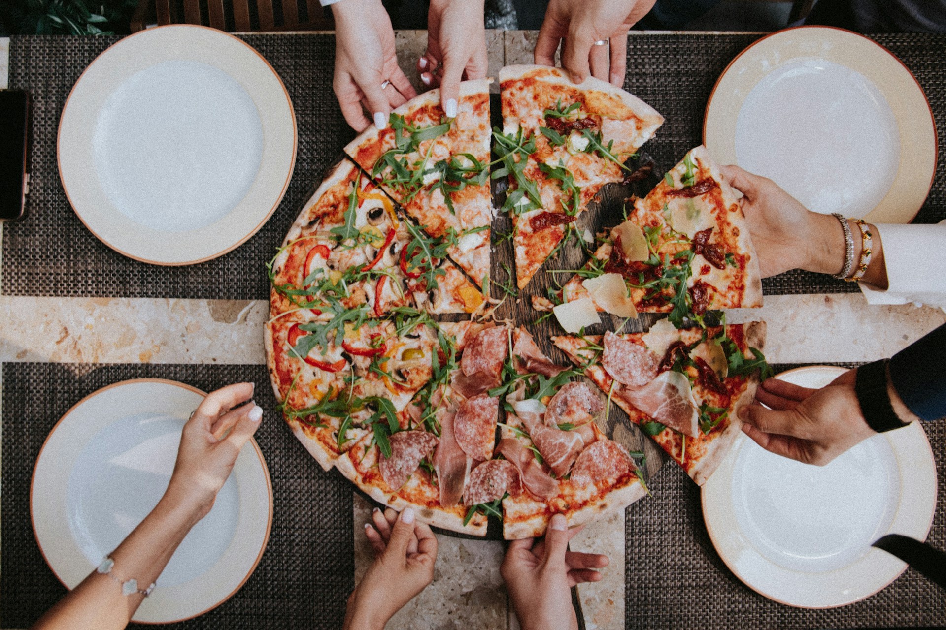 Fusion pizza topped and ready to slice